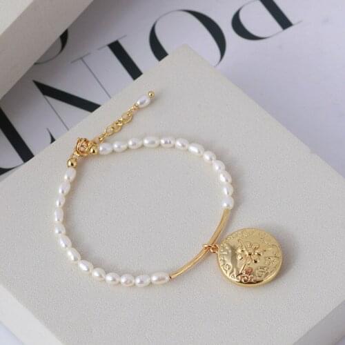 Simple temperament freshwater rice grain pearl golden smile sliding tube disc bracelet bracelet