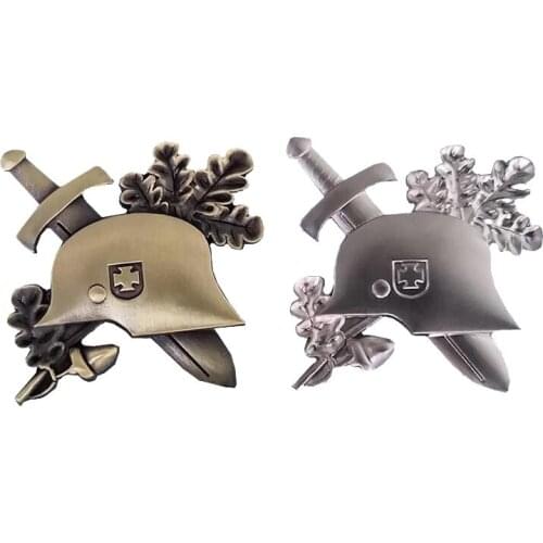 WWII Germany helmet lapel pin set with sword and oak leaves