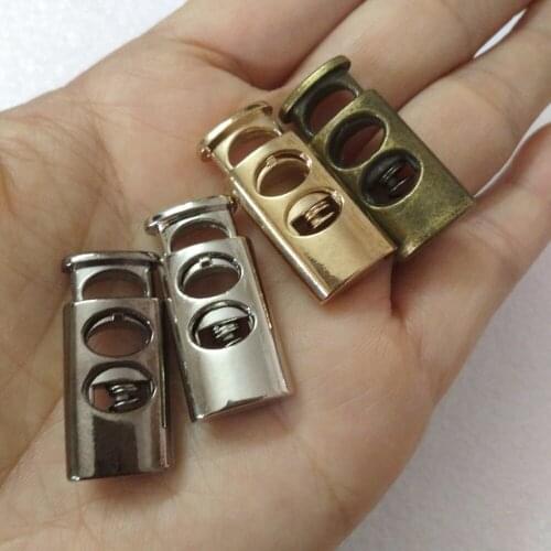 Wholesale Free shipping 50pcs 28*13mm Big Oval metal alloy stoppers toggle cord locks Drawstring lock with 7mm holes 4 colors