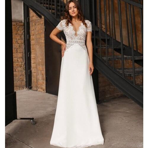 2021 Boho Wedding Dresses Deep V-Neck Short Cap Sleeves Open Back Lace Appliques Floor Length Simple A-Line White Bridal Gowns