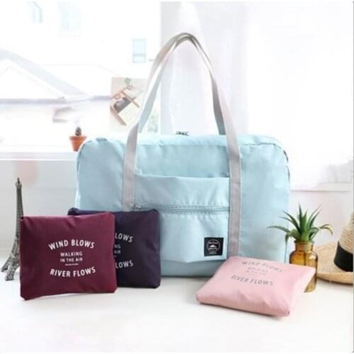 Version of large-capacity one-shoulder telescopic tie travel bag folding waterproof clothing storage bag finishing storage bag