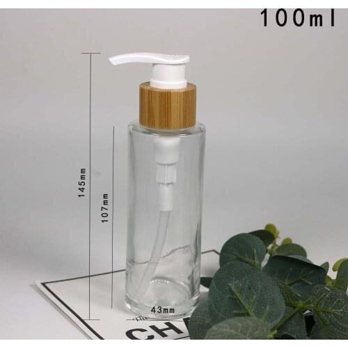 100ml Cylindrical transparent glass emulsion bottle cosmetics packaging with bamboo lid