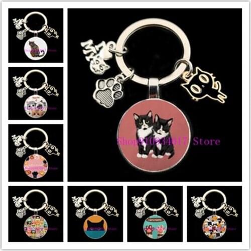 Cute pet black cat paw print picture round glass keychain cartoon black cat pendant ladies fashion round glass car keychain