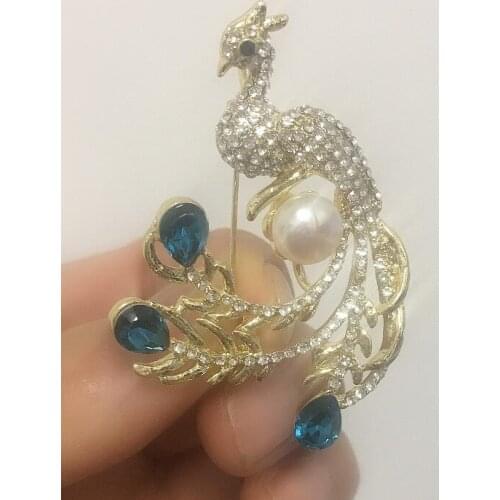 White sea shell pearl Cubic Zirconia micro pave peacock brooch