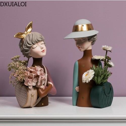 Decorated bedroom and dining room decorations with dry cartoon flowers carved in vases supported by resin girls in modern Nordic