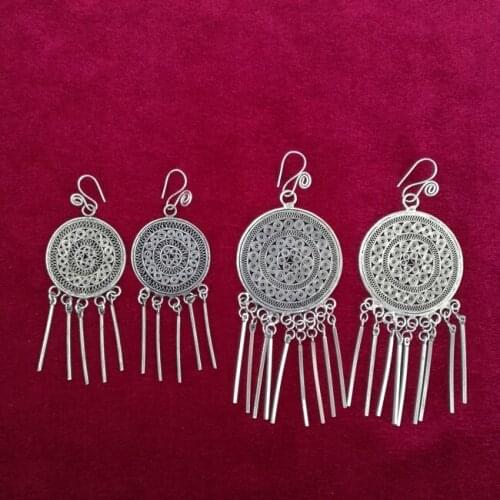 Guizhou Miao handmade jewelry national wind handmade Miao earrings traditional pinch fillet copper drum tassel earrings