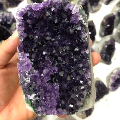 A natural amethyst cluster of Uruguayan specimens, the perfect cargo can purify the air and heal