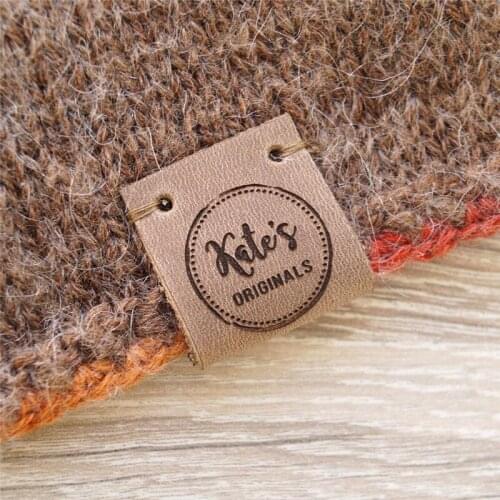 Knitting labels, center fold leather labels, crochet labels, folding labels, leather tags, branding logo labels