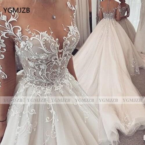 Customized Long Sleeves Wedding Dresses in Dubai Plus Size 2020 Lace Appliques Beaded Bridal Wedding Gown Robe De Mariee