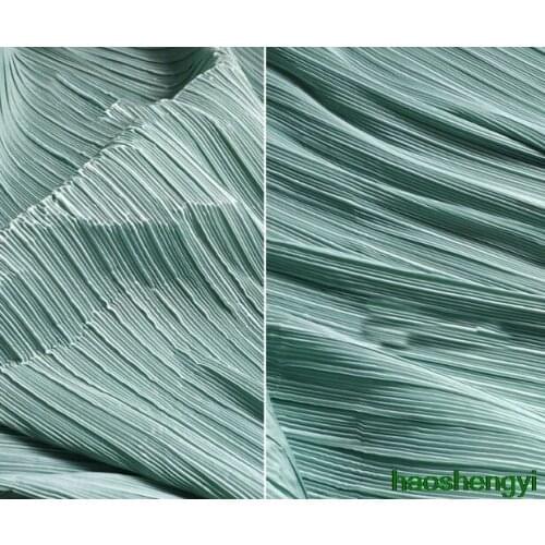 High quality creative rigid green straight pleated texture soft clothing fabric