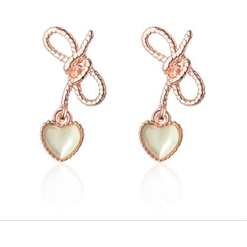 Heart-shaped Korean version of the small fresh hollow butterfly green cat eyes sweet silver plated stud earrings WE011