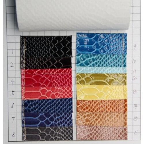 Wholesale shiny pu leather fabric serpentinite shiny artificial leather fabric material