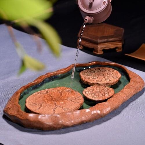 The new coarse pottery pot bearing dry bubble tea tray handmade pot mat water lotus tea way