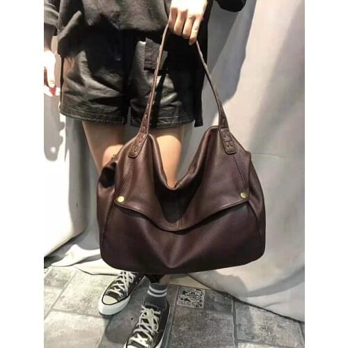 The new 2021 first layer cowhide Pandora box woven bag is a one-shoulder cross-slung bag for women