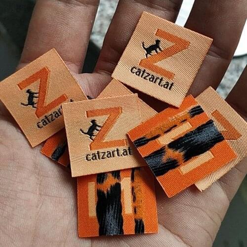 4000pcs , 3 * 3 cm Custom hot iron glue on orange damask cloth woven label Straight cut tags