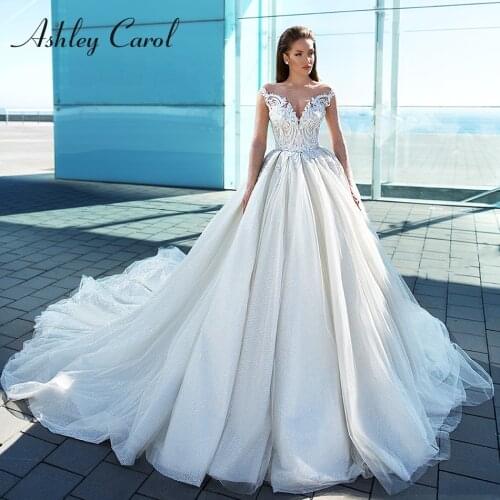Ashley Carol Illusion Long Sleeves Wedding Dress 2021 Beaded Appliques Shining Chapel Train Bridal Dress Vintage Wedding Gowns