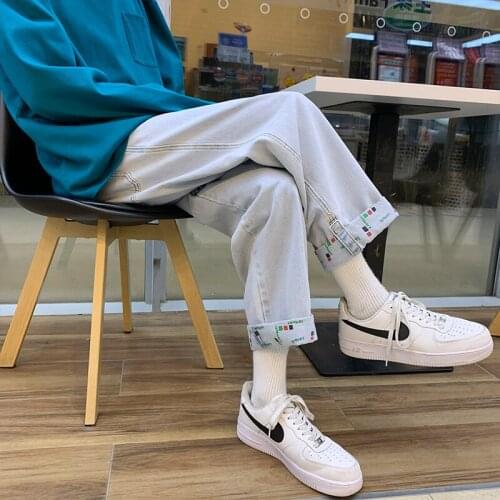 Autumn mens and teenagers jeans with the same print for men and women, loose casual personality, variable foot trousers, campus