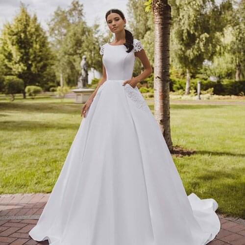Robes De Mariage Short Sleeve Satin Ball Gown Wedding Dress Illusion Back Lace Appliques Bridal Gown with Pocket