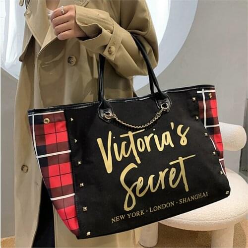 2021 New Famous Designer Large Capacity Rivet Women Travel Bags High Quality Canvas Shoulder Bags Fashion Women Handbags