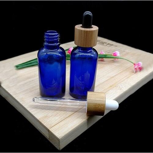 Wholesale Empty Blue And Green Clear Glass Essential Oil Bottle Cosmetic Dropper Container Repeatable Products
