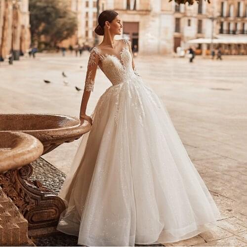 UZN Elegant Ivory A-Line Illusion Scoop Neckline Lace Appliques Wedding Dress New Arrival Half Sleeves Glitter Bridal Gown