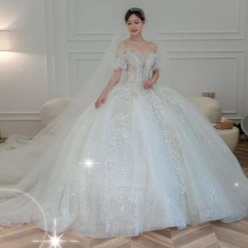 2021 Wedding Show In Dubai Ball Gown Bridal Wedding Gown Ruffles Sleeves Crystals Bow On Back Bridal Dresses Wedding Dresses