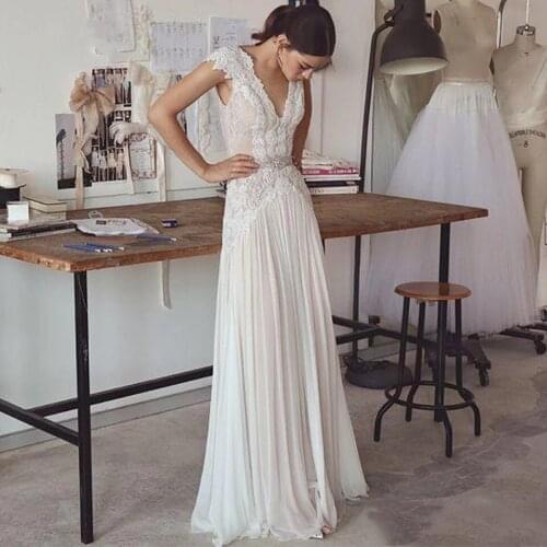 Boho V Neck Wedding Dresses Chiffon Bohemian Wedding Gowns Cap Sleeves 2021 Backless Pleated Skirt Elegant A line Bridal Gowns