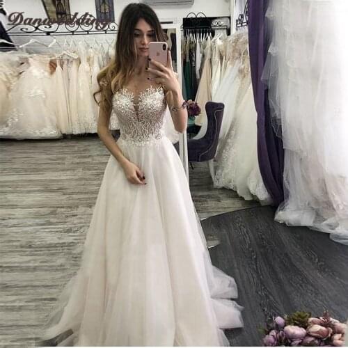 Junoesque Scalloped-Neck A-line Wedding Dresses Lace Applique BrIdal Dress Sexy Illusion Back Covered Button Wedding Gowns