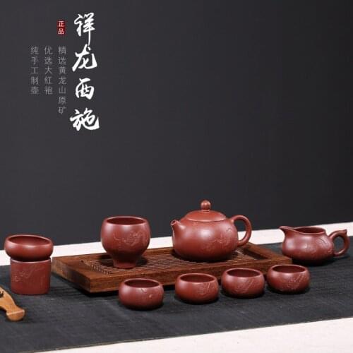 Red clay pot gift set big red robe Xianglong Xishi pot carving tea set nine piece set teapot carving manufacturer