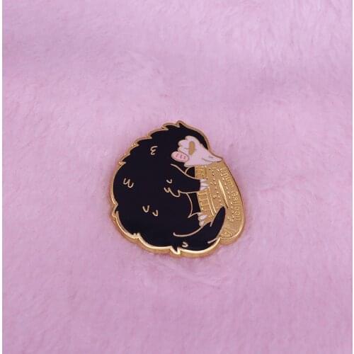 Niffler holding galleon brooch shiny coin pin wonderful Wizarding World fans collection