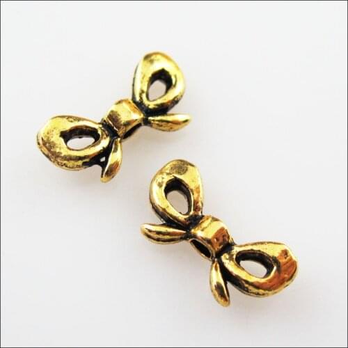 70Pcs Antiqued Gold Color Butterfly Knot Spacer Beads Charms 6x12mm