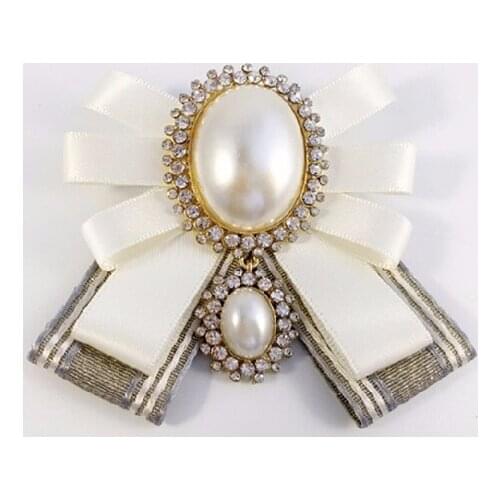 Free shipping new female male fashion 2017 college wind big pearl bow tie knot retro Headdress brooch antique cloth corsage pin