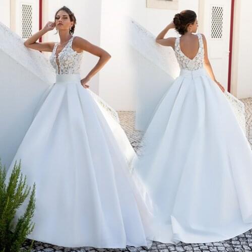 Beautiful V Neck Beach Wedding Dress Sleeveless Ball Gown Satin with Handmade Flower 2021 Bridal Gowns Sweep Train