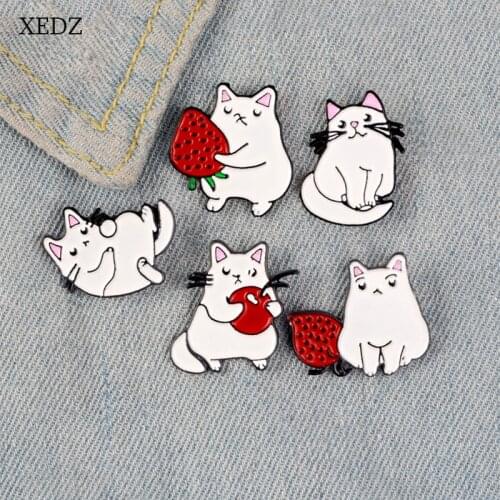 XEDZ new white cat holding strawberry brooch fashion personality cute cartoon cat various forms badge denim clothes pendant gift