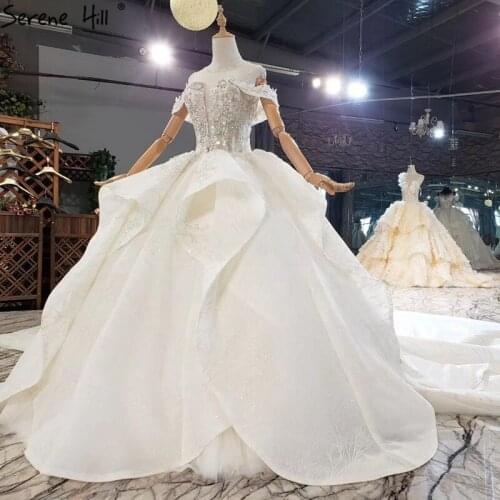 Ivory Luxury Sleeveless Princess Wedding Dresses 2020 Dubai Diamond Beading O-Neck Bridal Gowns HX0264 Custom Made