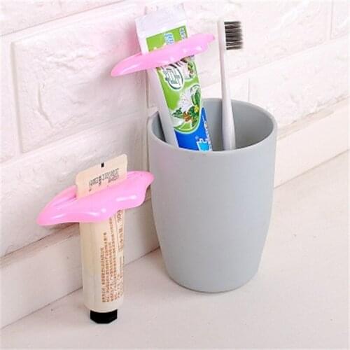2PCS Novel Random Color Lip Shape Toothpaste Tube Face Wash Cleaning Foam Cream Roller Squeezer Dispenser