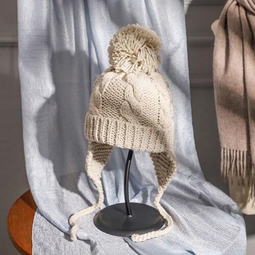 Korean version of the solid color hair ball yarn Lei Feng hat female winter warm ear protector Japanese riding knit hat