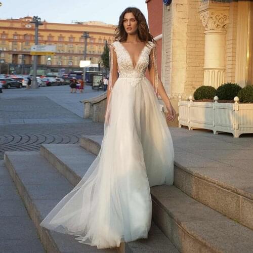 Illusion Deep V-neck Tulle Wedding Dresses with Beading Tassel Ivory Lace Appliques Floor length A Line Bridal Gowns