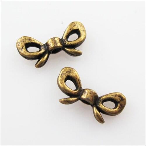 70Pcs Antiqued Bronze Color Butterfly Knot Spacer Beads Charms 6x12mm