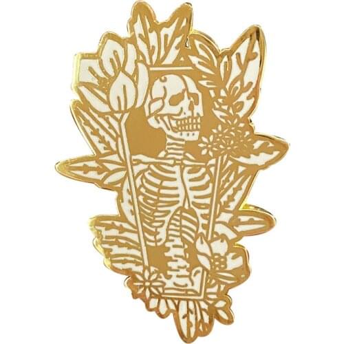 Are you a lover of all things odd and curious, this funny golden coffin skeleton enamel pin will meet your need