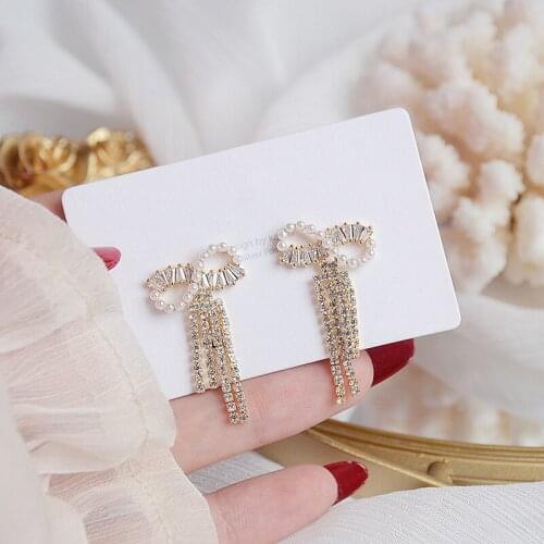 ALLNEWME Delicate Bling Zircon Faux Pearl Bowknot Dangle Earrings for Women Ladies Long Rhinestone Tassel Earrings Accessories