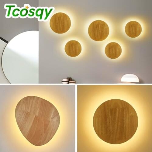 Tcosqy wood wall lamp is used for bedroom and living room staircase wall decoration. The AC voltage is round and oval warm light