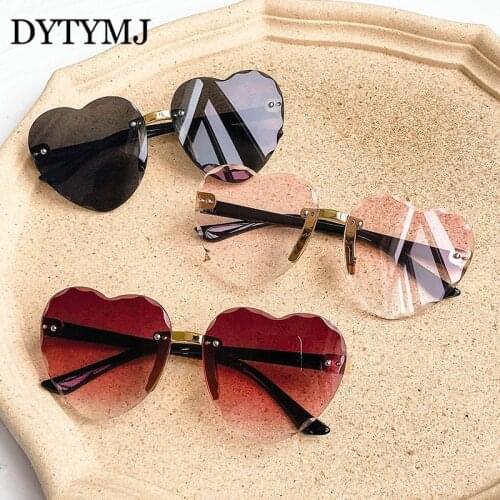 DYTYMJ Children Sunglasses Heart Rimless Sunglasses for Kids Ocean Gradient Shades Girls Peach Heart Sun Glasses for Kids