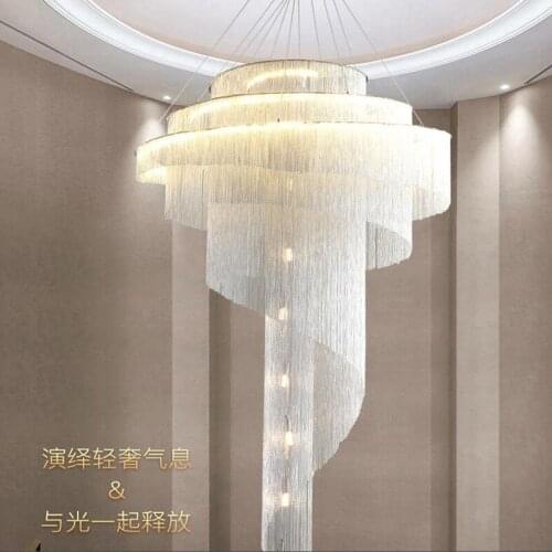 Post-modern duplex building large chandelier empty living room villa golden tassel spiral staircase light