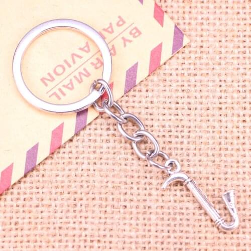 20pcs New Fashion Keychain 17x27mm saxophone instrument music Pendants DIY Men Jewelry Car Key Chain Souvenir For Gift