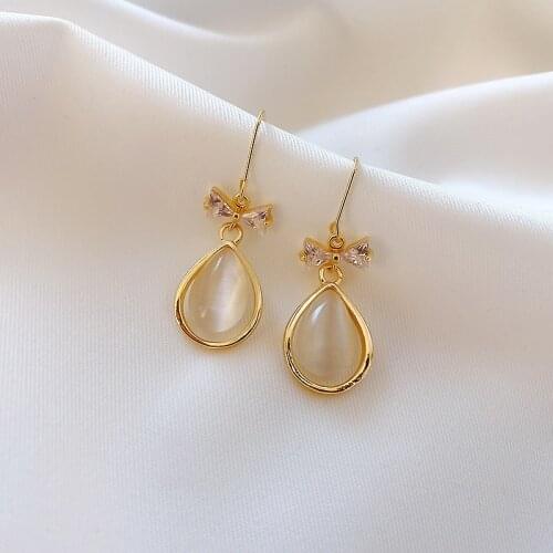Sweet Girl Earrings Korean Bowknot Crystal Cat Eye Drops Simple And Small Net Red Temperament Earrings Womens Wholesale Pataya