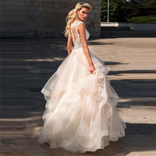 Off Shoulder Lace Appliques Tulle Ruffles Wedding Dress Buttons Back Pleated Bridal Gowns 2020 Formal Princess Puffy Garden