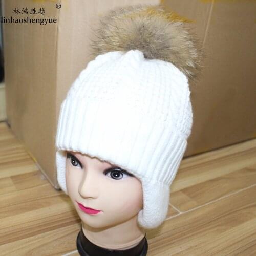 Linhaoshengyue Winter Warm Fashion Women Cap High Quality Knitted Cap Ear Cap with Real Raccoon Fur Cap Unisex