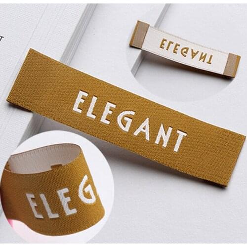 Standard trademark custom-made cloth standard custom woven label made of high density double face brocade gold red label