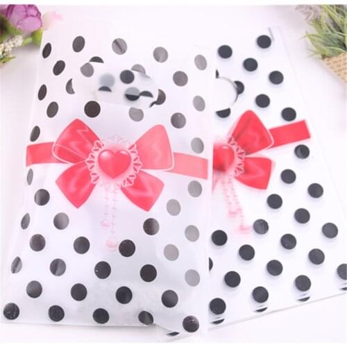 Wholesale 100pcs/lot 13*18cm Favor New Year Packing Lovely Dot Party Plastic Gift Packaging Bags with Red Heart Bow